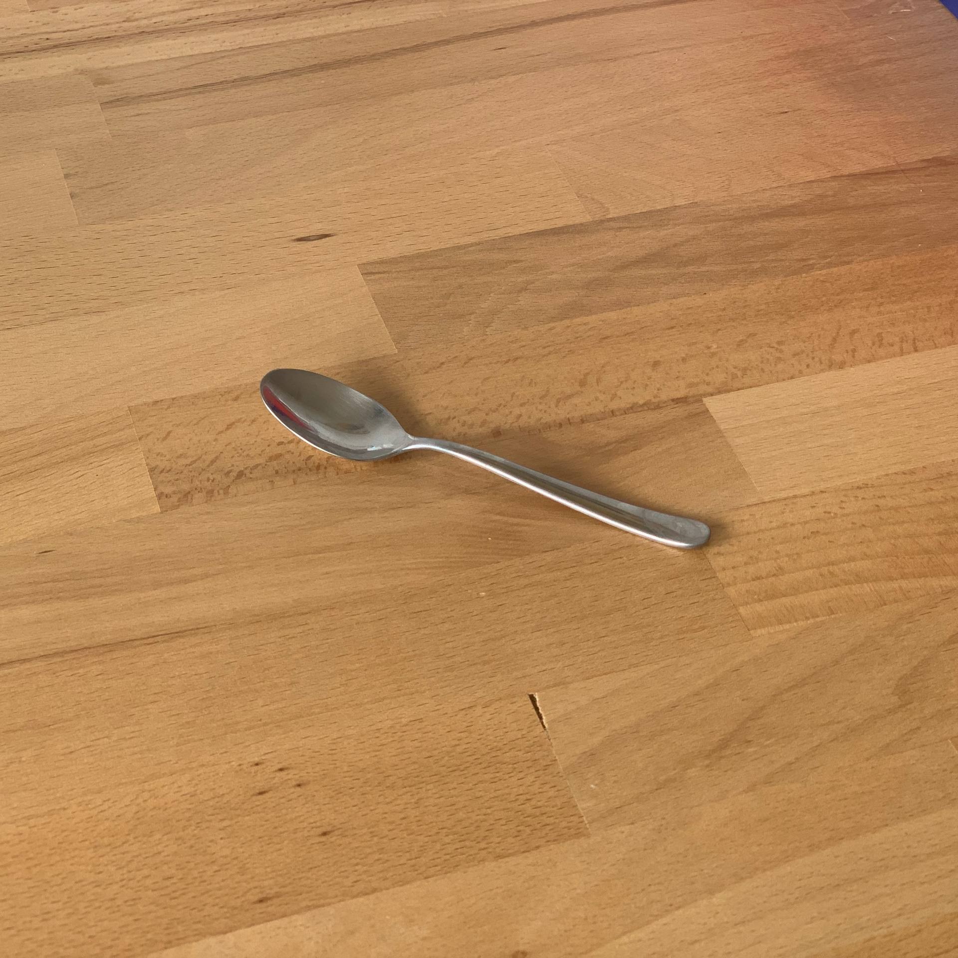 Small Spoon on wodden surface