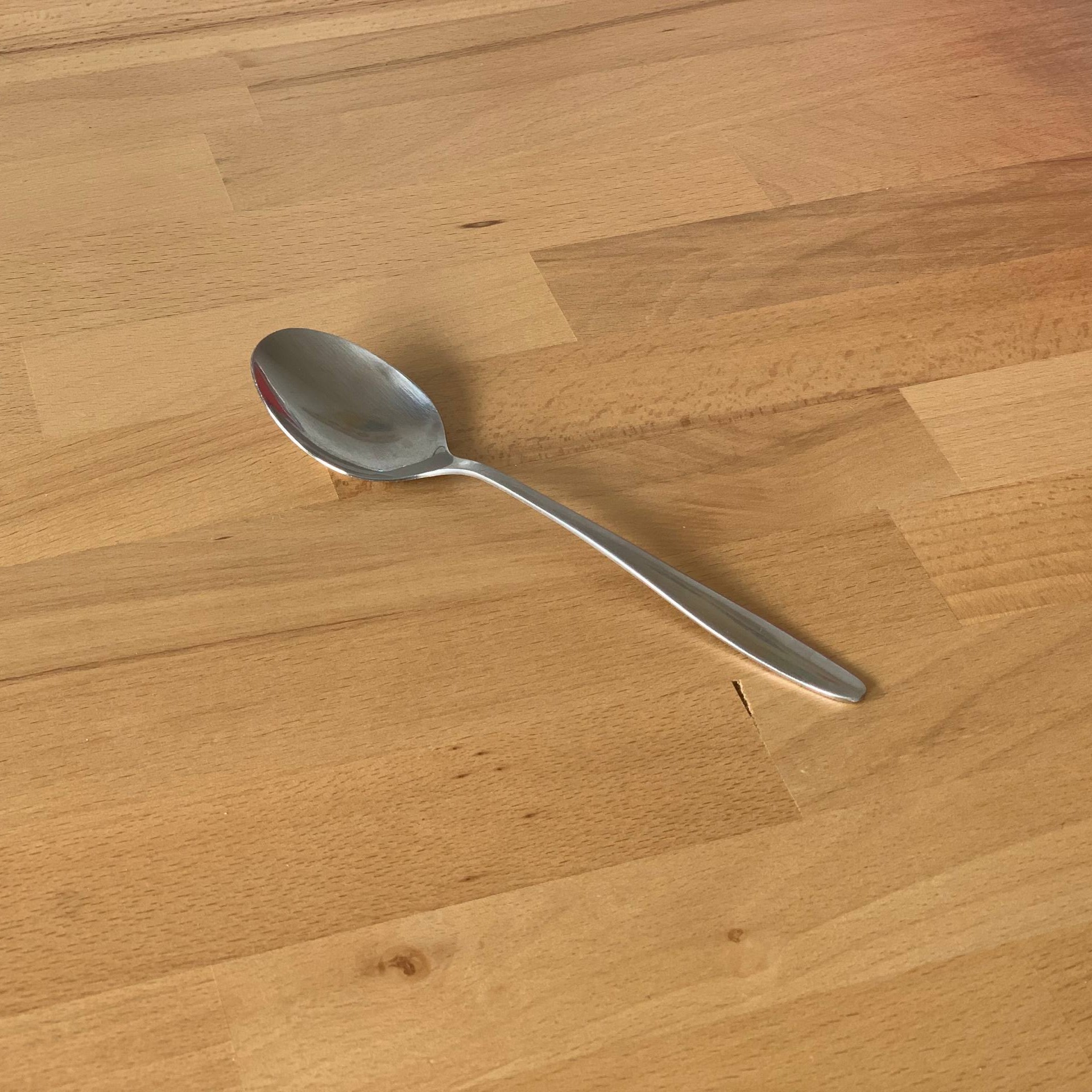 Big Spoon on wooden surface
