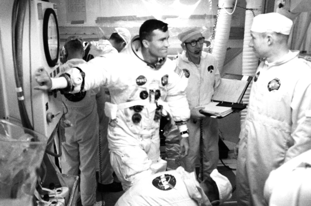 Astronauts with NASA scientists in the spaceship before the Apollo 13 mission